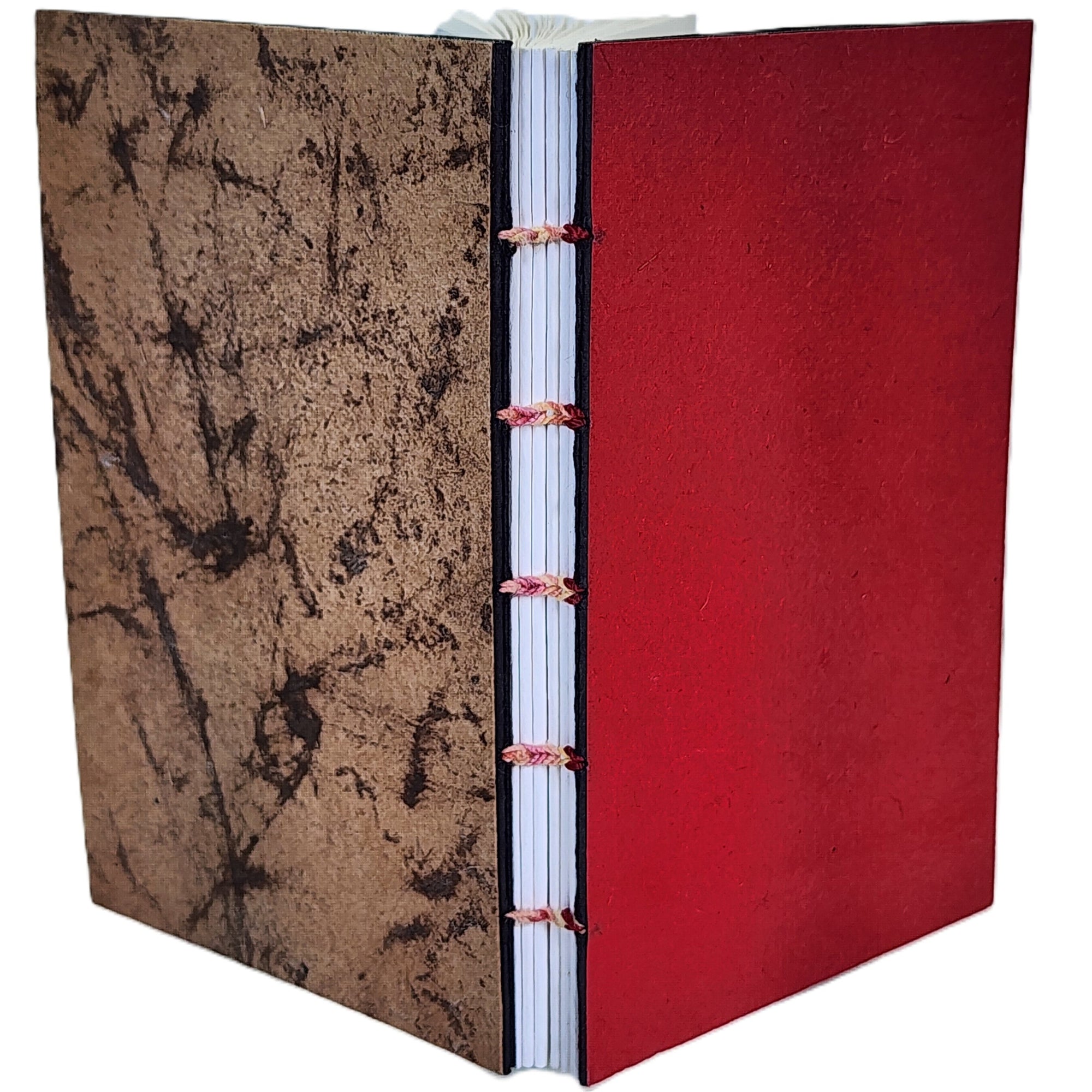 Handmade notebook with red front cover  and crackle back cover, six signatures of white paper, coptic-bound with variegated red/pink linen thread. ~3.75×6″ · 120 pages.
