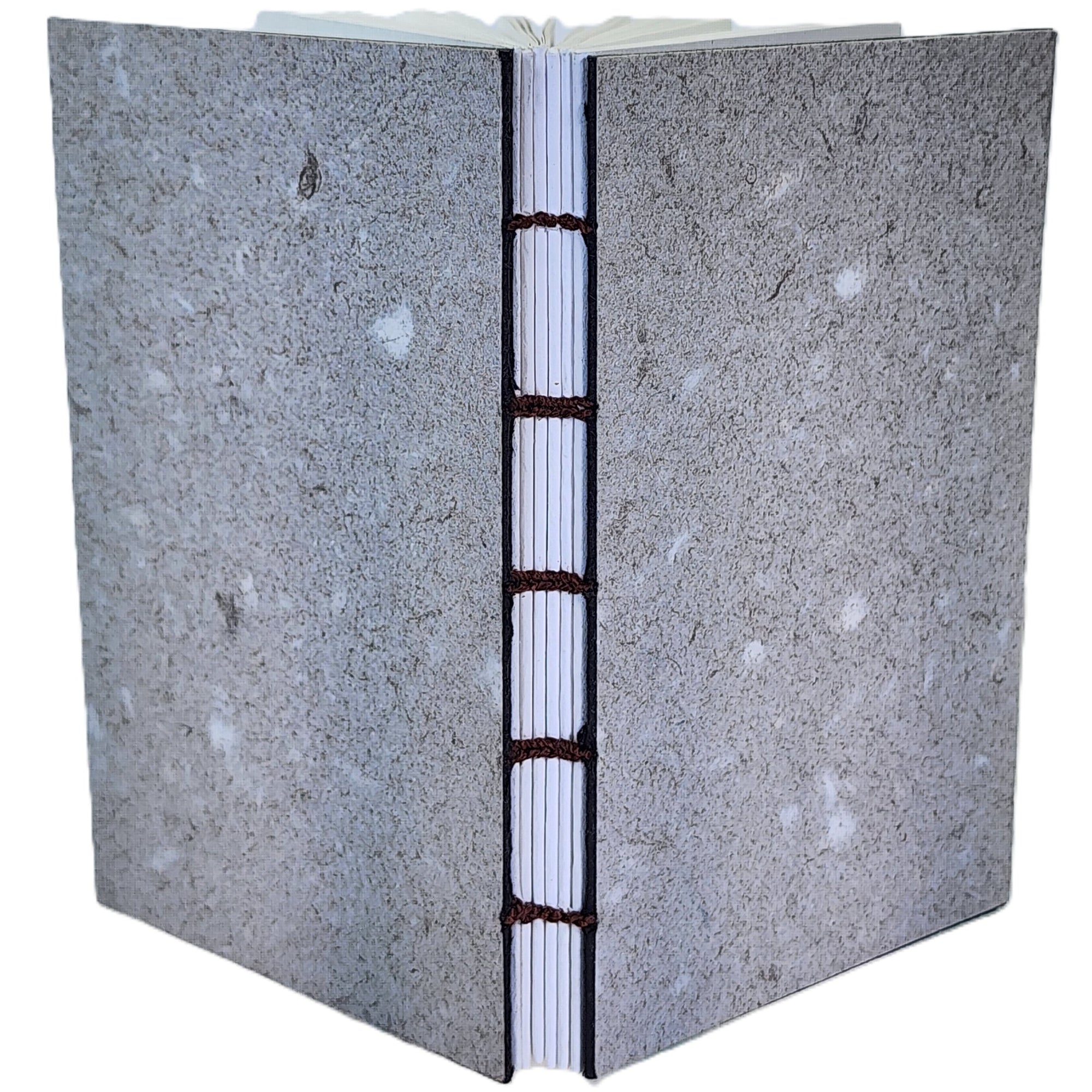 Handmade notebook with speckled taupe paper on covers, six signatures white drawing paper, coptic-bound; ~3.75×6″ · 120 pages.