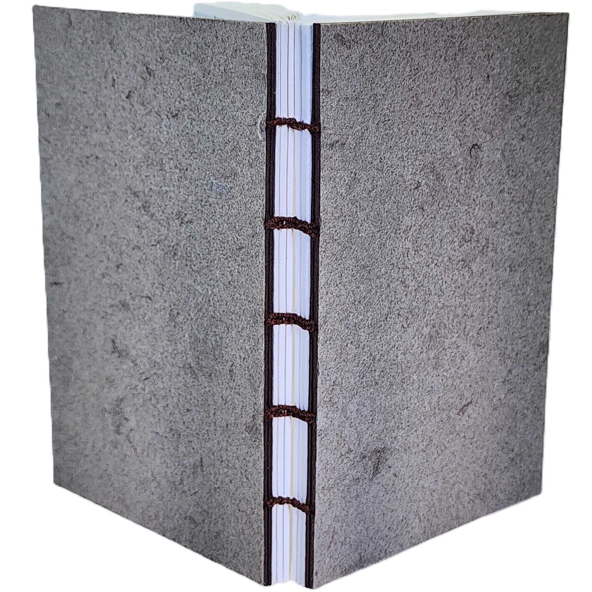 Handmade notebook with taupe paper on covers, six signatures white paper, coptic-bound; ~3.75×6″ · 120 pages.