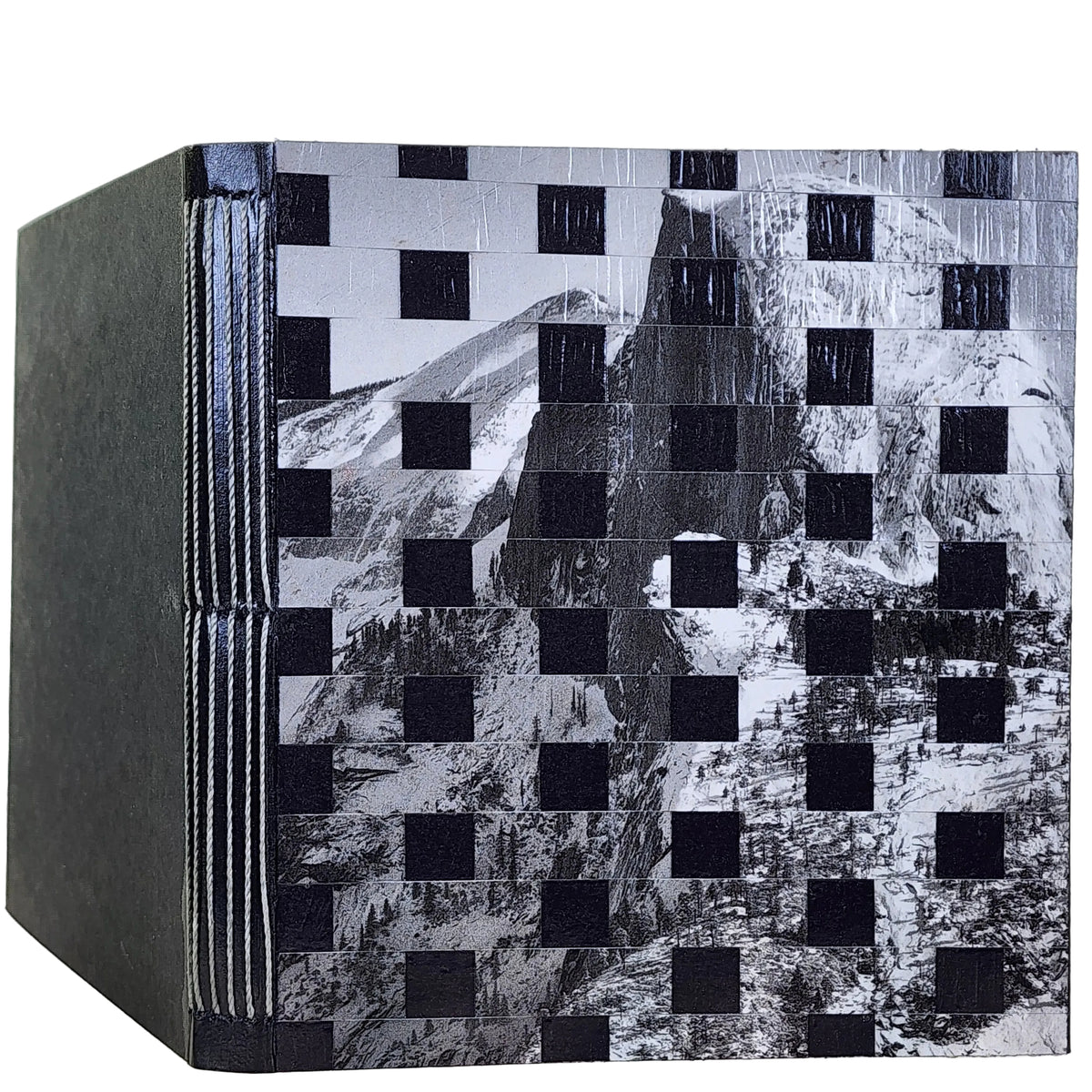 Handmade book with a long-stitch binding. The cover is a black-and-white photograph by Ansel Adams that has been handwoven with black strips to create a checkerboard pattern.