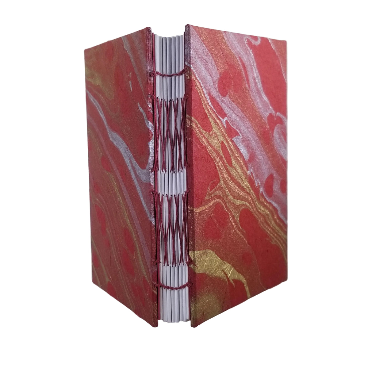 A handmade hardcover journal with a red, gold, and white marbled cover, bound with red thread and showing white pages, set against a plain white background.