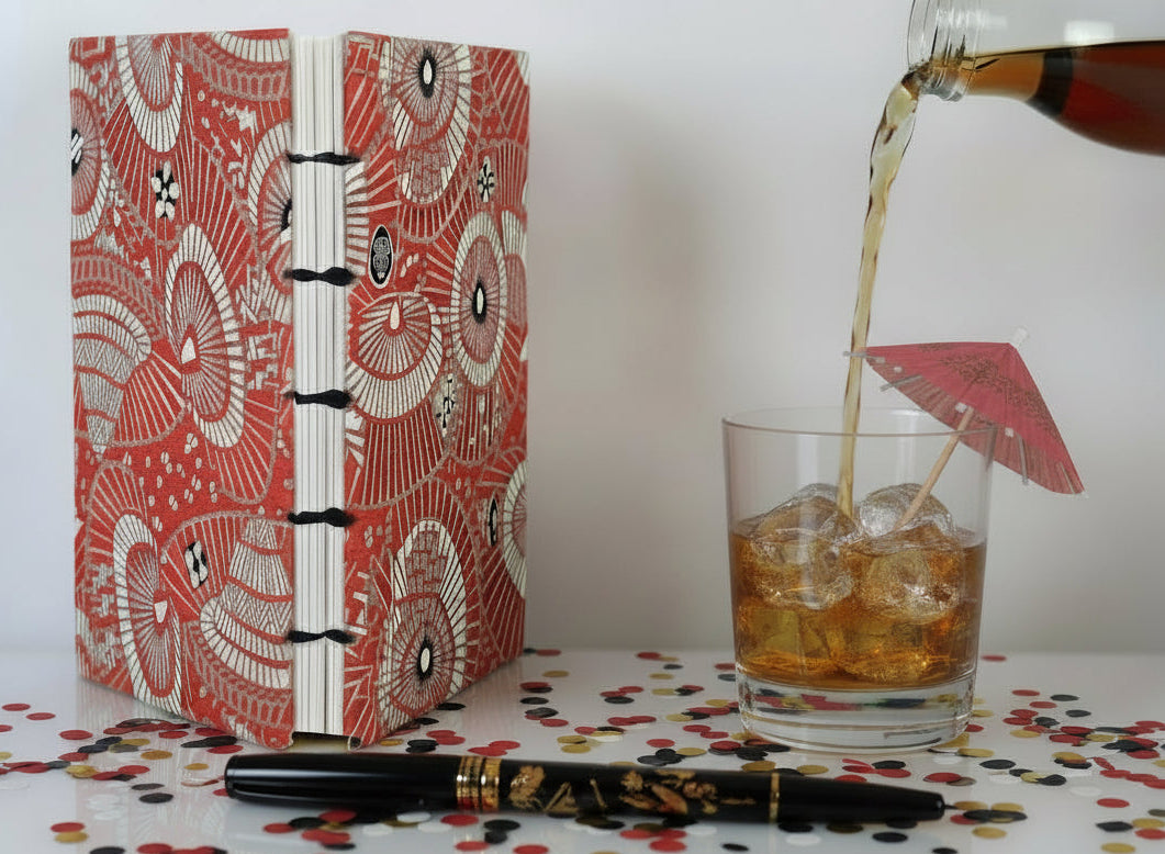 A computer-generated image of a similar handmade book in a festive setting.