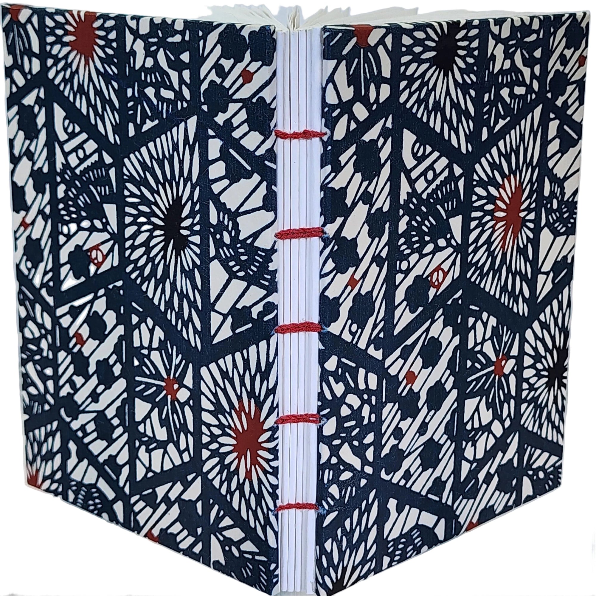 Handmade journal with Japanese Katazome-Shi cover paper, in a blue geometric pattern with red accents, from the former studio of Mr. Kawakatsu. 4.25x6, 112 pages.