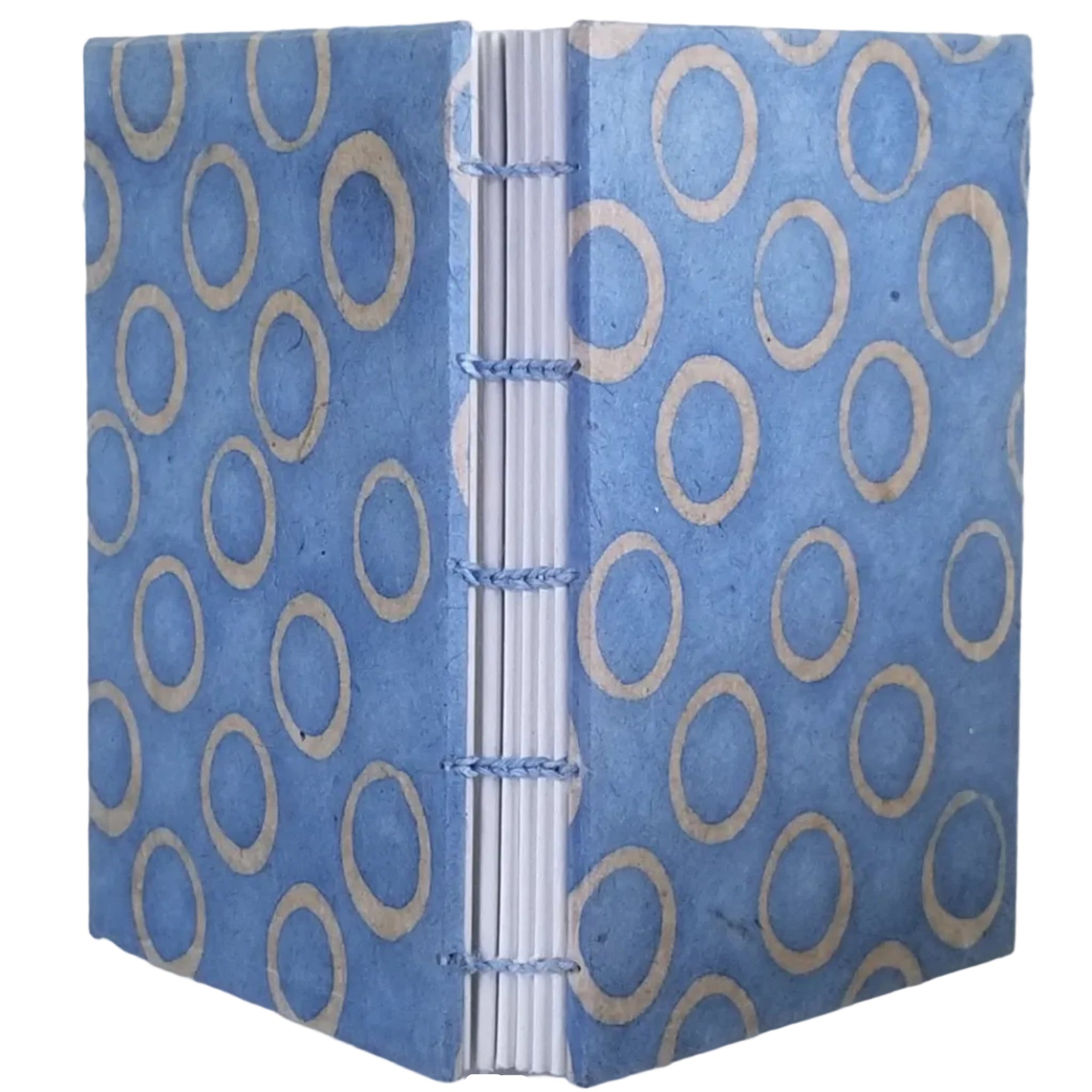 Handmade journal with light blue covers that have an abstract design of circles; six signatures of white paper; and coptic-bound with light blue thread. ~3.75×5.25" and 116 pages.