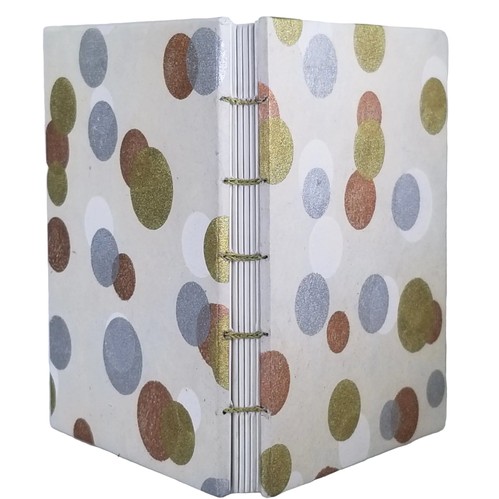 Handmade journal with plant-based paper on the covers in a pattern of gold, silver, copper, and white overlapping dots on a beige background; six signatures of white drawing paper; and coptic-bound with waxed linen thread. ~4×5.5" and 116 pages