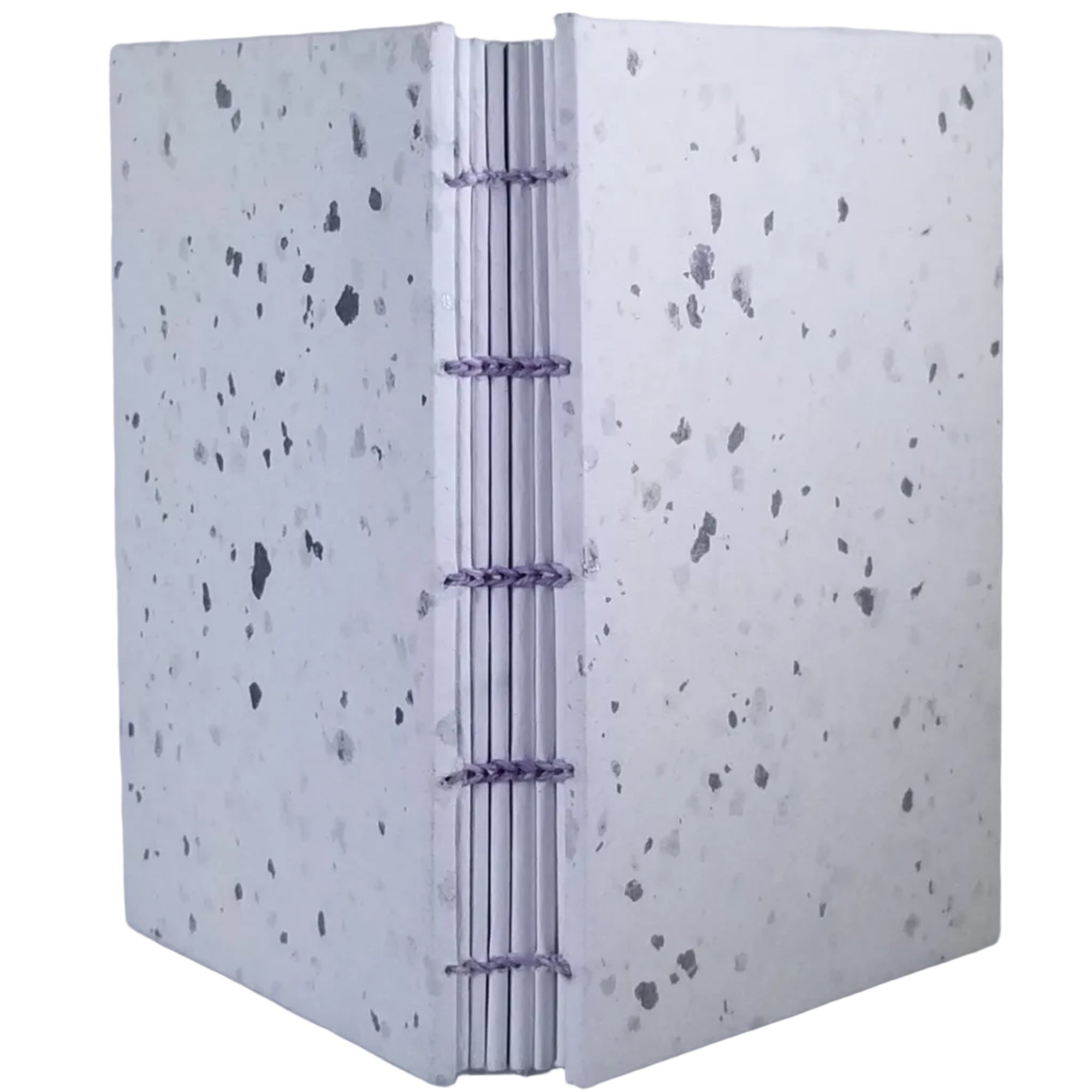 Handmade journal has white paper on the covers with silver confetti applied; six signatures of white paper; and is coptic-bound with lavender waxed linen thread. ~4×5.25" and 92 pages.