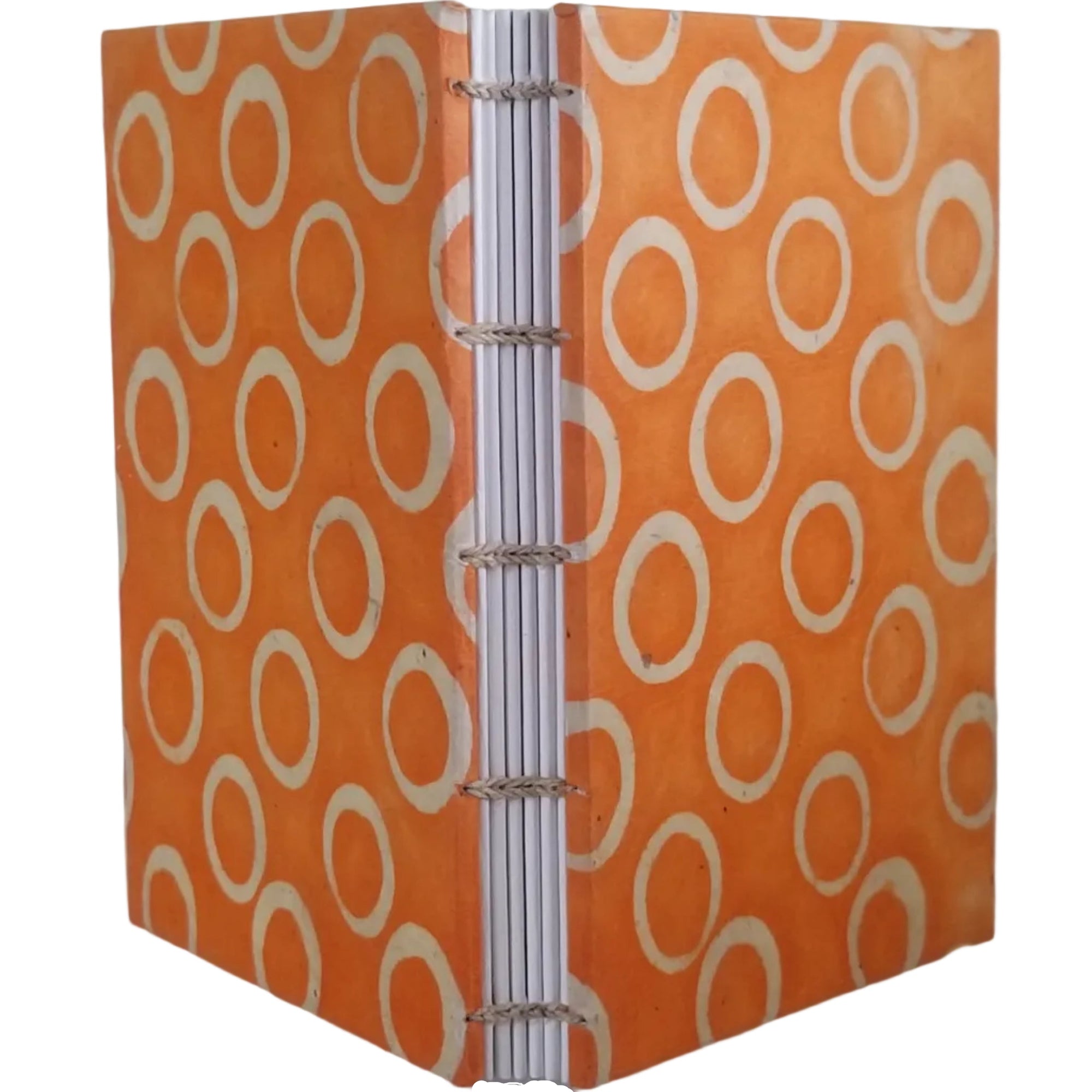 Handmade journal with orange covers that have an abstract design of beige circles; six signatures of white drawing paper; and coptic-bound with waxed linen thread. ~4×5.5" and 116 pages