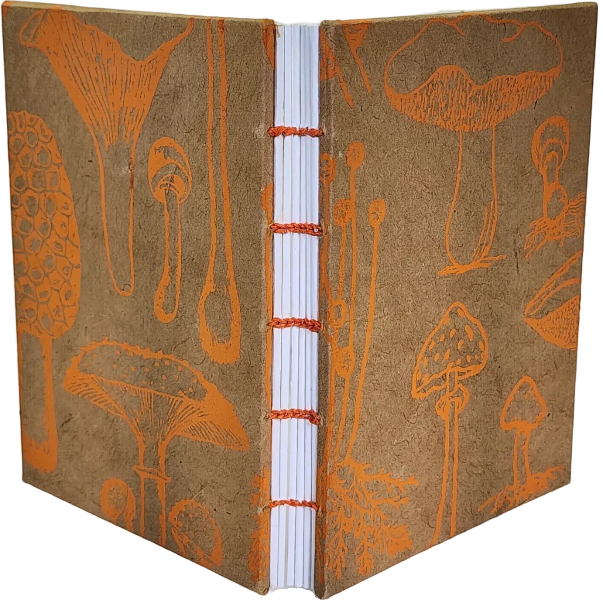 Handmade journal with Cognitive Surplus paper, in a pattern of orange mushroom line drawings, on kraft-paper color covers with orange coptic binding. ~4.25×6" 116 pages