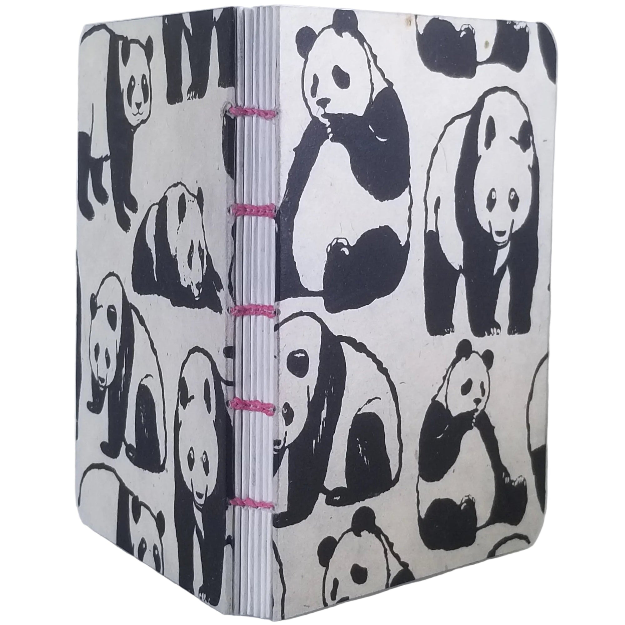 Handmade notebook with printed panda pattern, six signatures of white paper, coptic-bound using pink waxed linen thread; ~4×5.25″ with 120 pages.