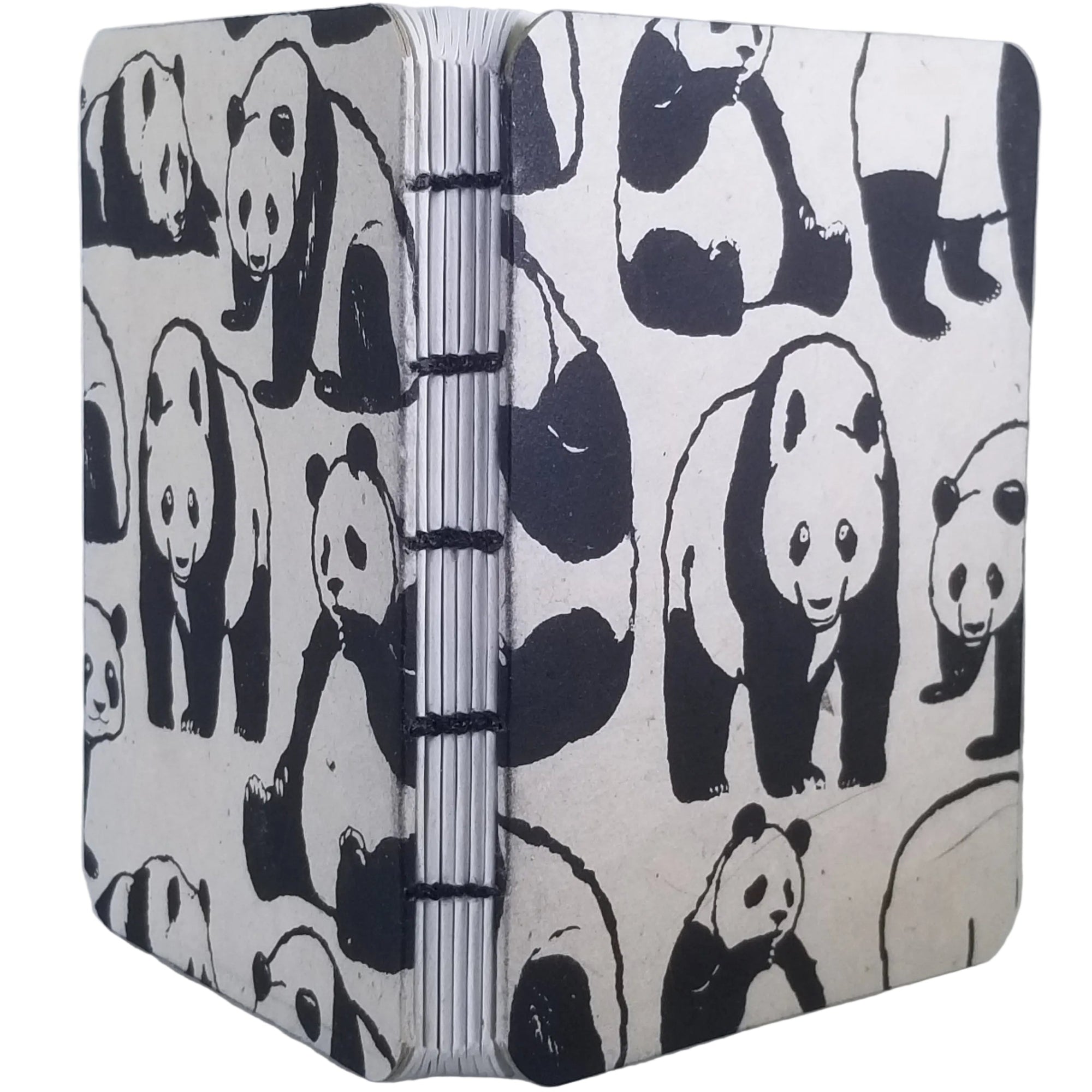 Handmade notebook with black printed panda pattern, six signatures of white paper, coptic-bound using black waxed linen thread; ~4×5.25″ with 120 pages.