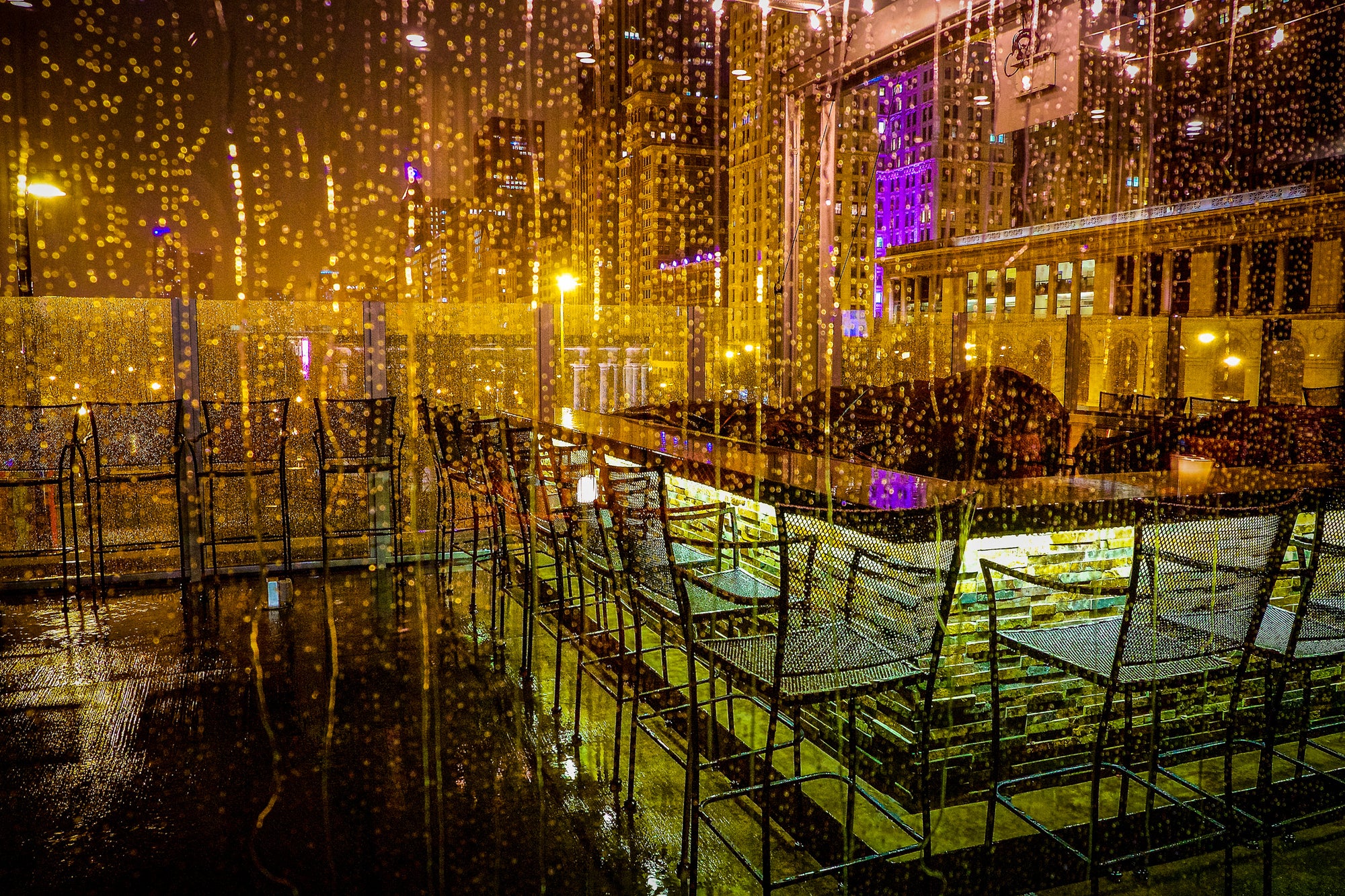 Original fine art photo of a Chicago tavern's second-level patio in the rain, by Rick Graves — right panel of a diptych. Each print $25 plus shipping.