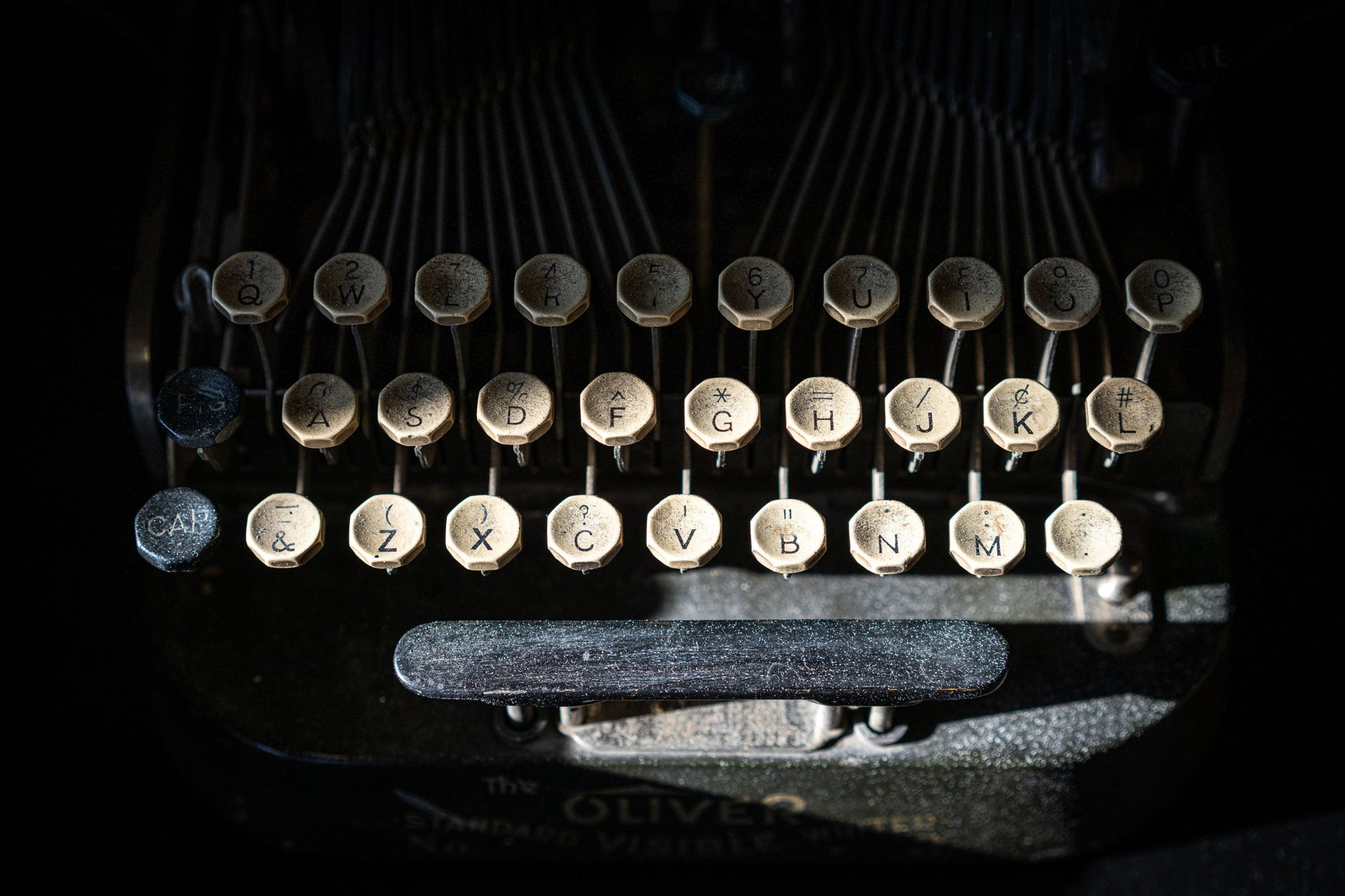 Close-up of a vintage Oliver typewriter keyboard with visible wear.