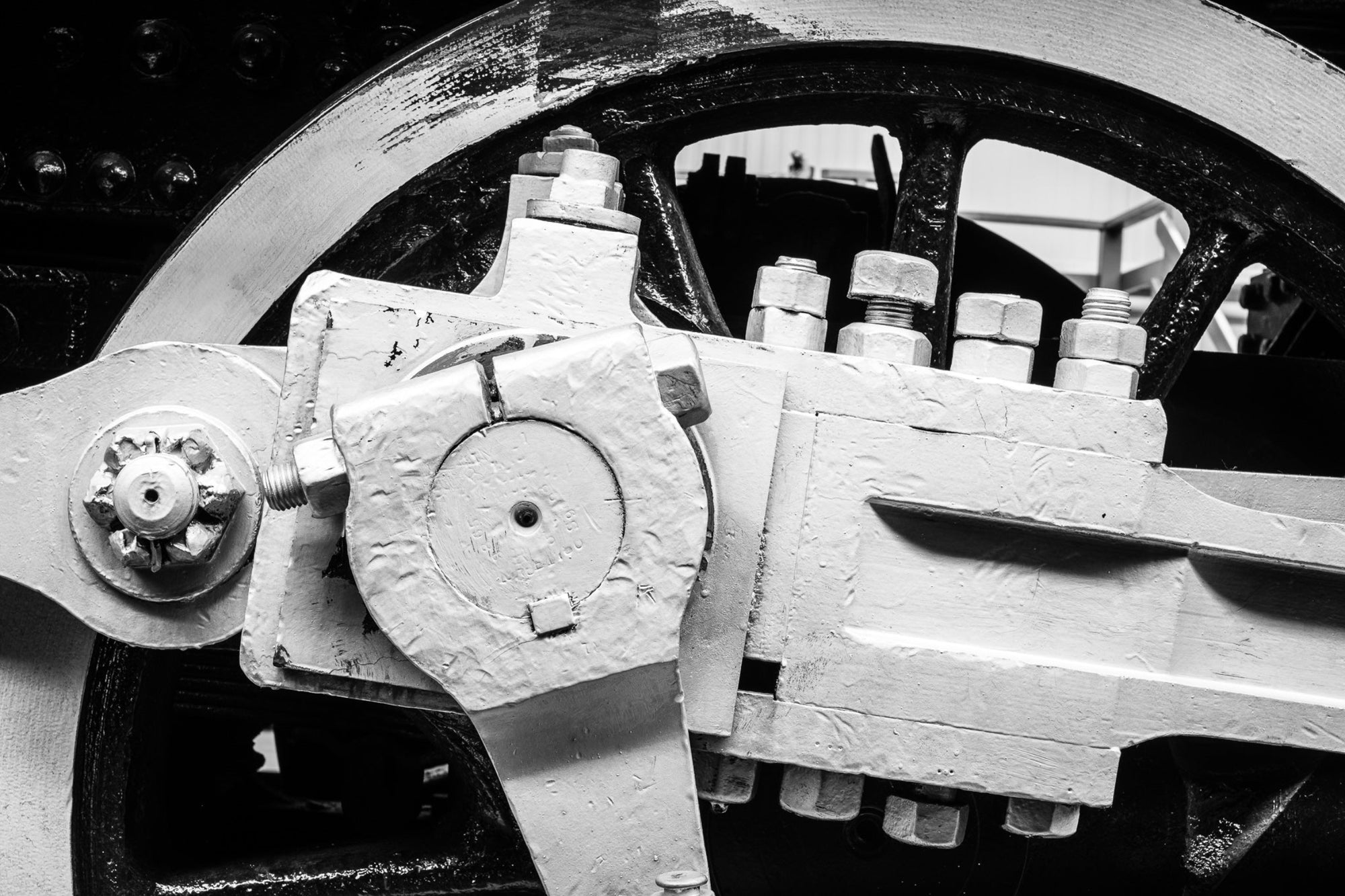 Rick Graves' photograph "Trumpet Nuts" - black and white vintage railroad locomotive wheel with trumpet nuts