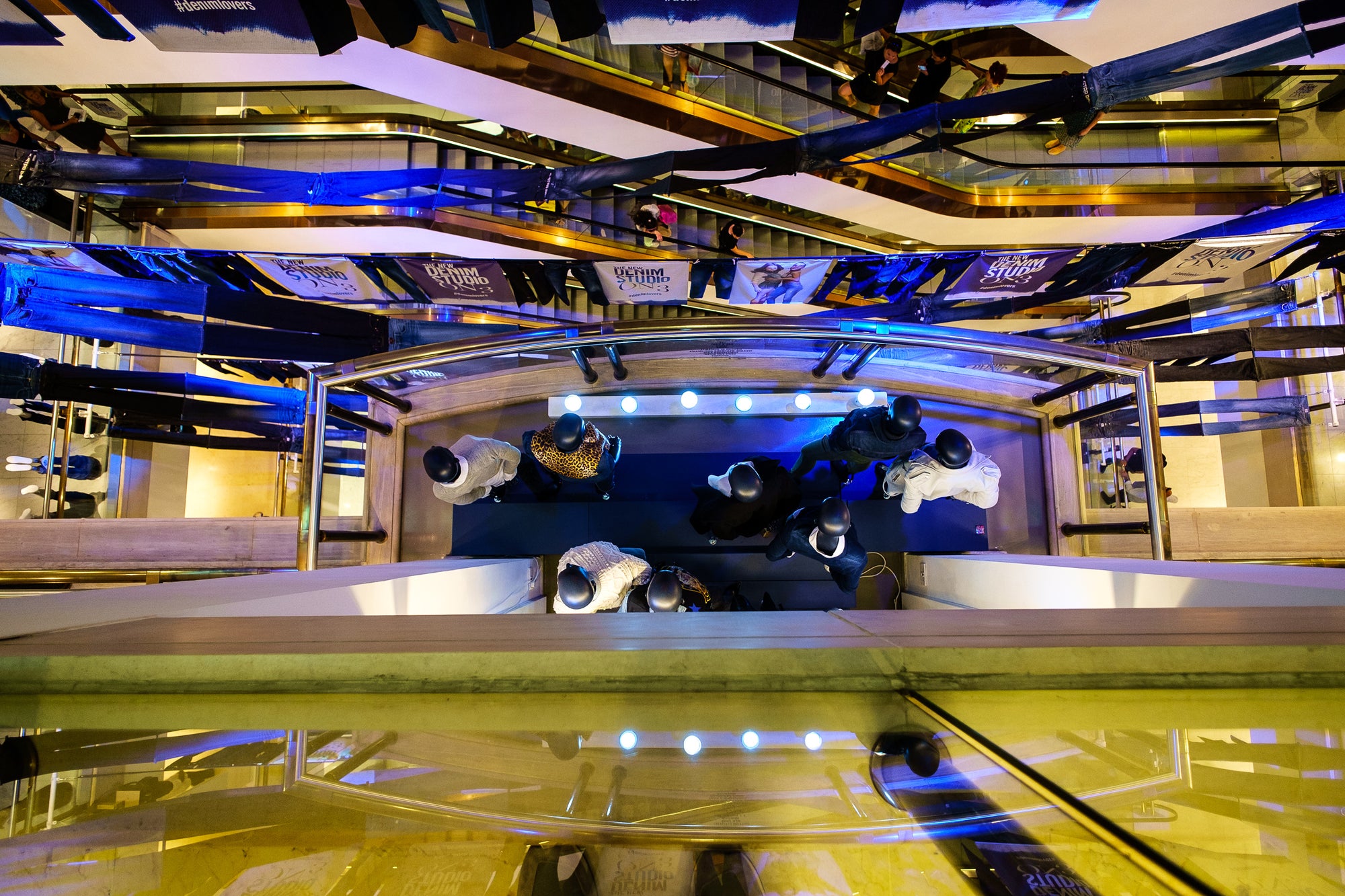 Multi-floor interior of Selfridges Department Store (London) shot from above; photographer Rick Graves