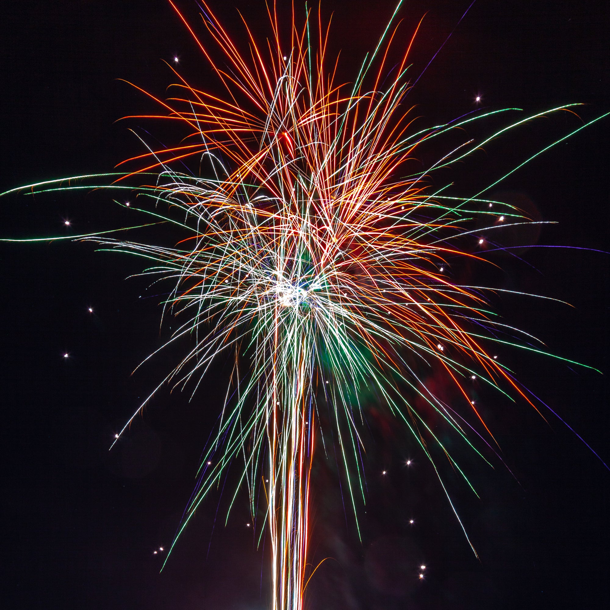 Colorful fireworks display against a black sky; photographer Rick Graves