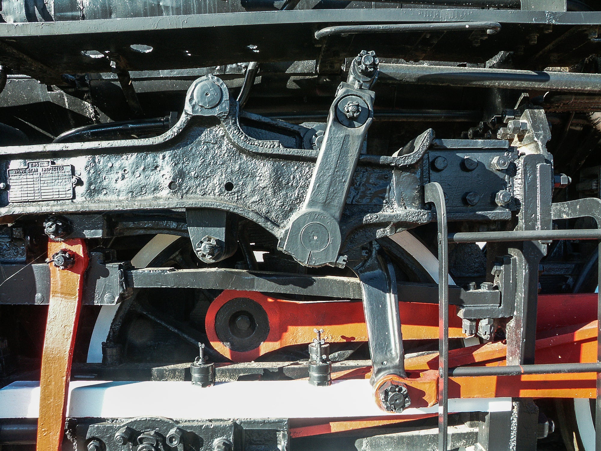 Close-up of colorful mechanical components on a train locomotive; photographer Rick Graves