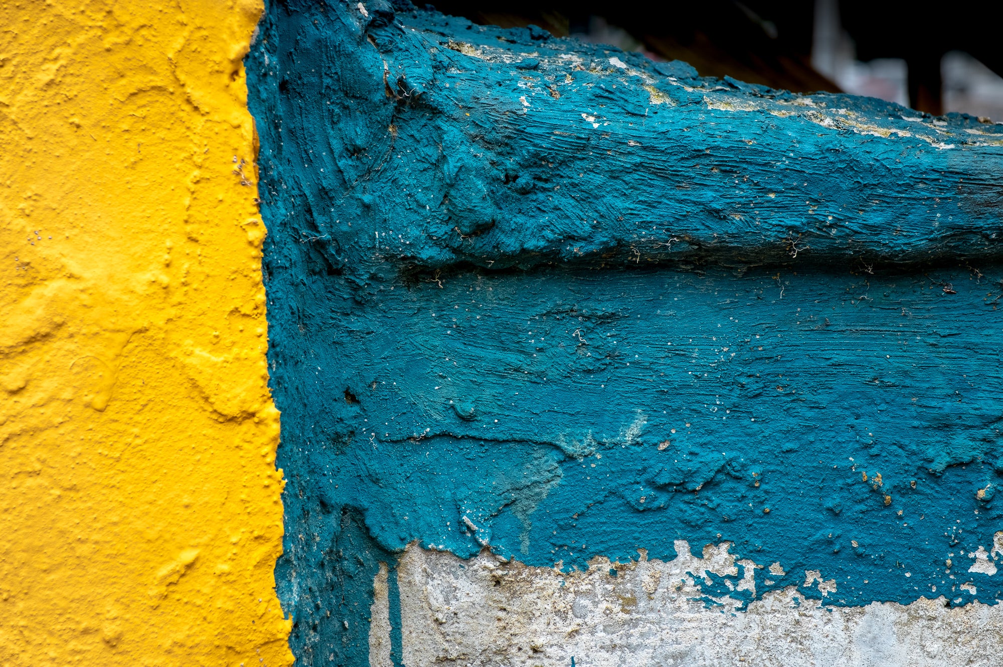Photo by Rick Graves of yellow and blue paint on concrete, colors echoing the Ukrainian flag. Every print $25 plus shipping.