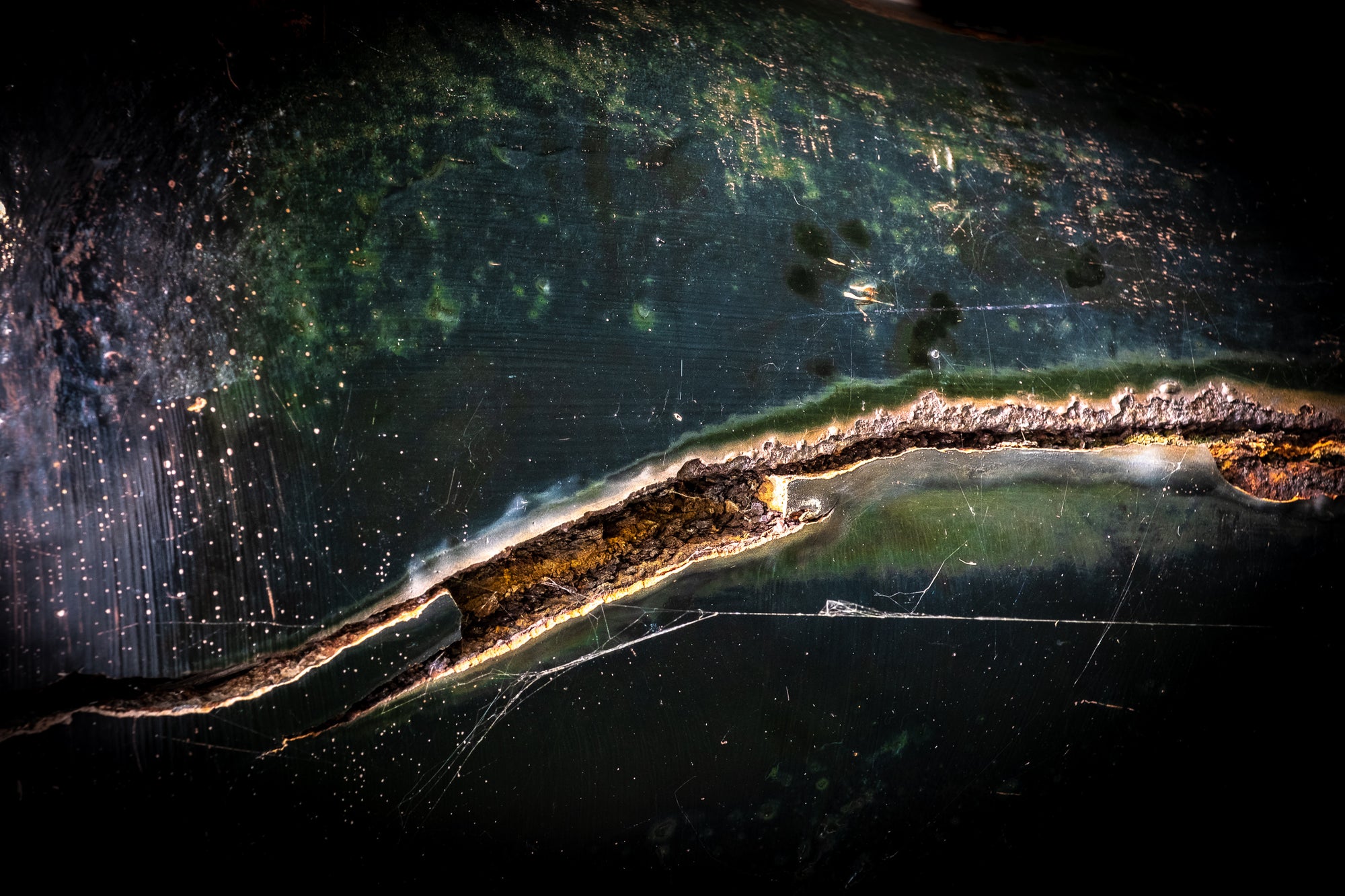 Photo by Rick Graves of a mooring bollard on Lake Superior, reads as an abstract aerial view of land, water, and light. Every print $25 plus shipping.