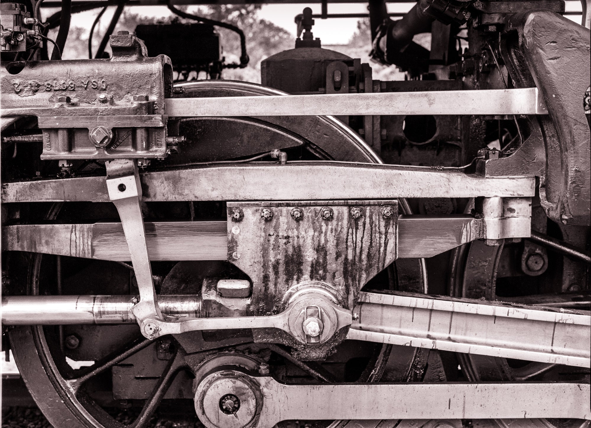 Close-up of mechanical components on a vintage train or steam engine.