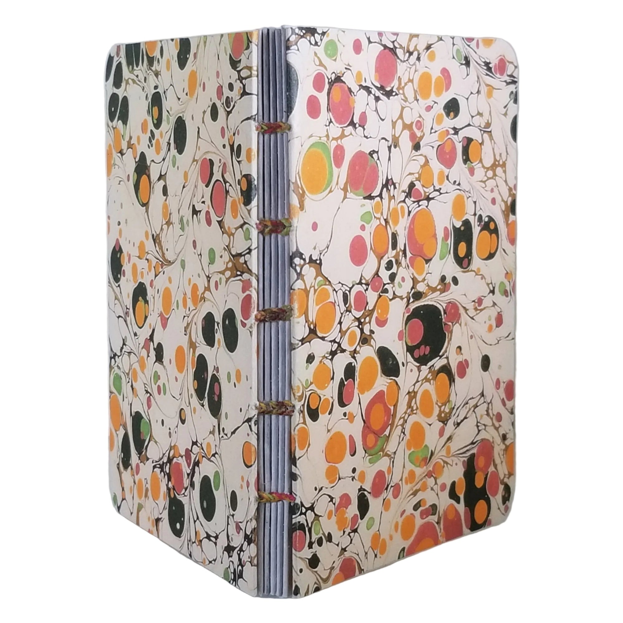 handmade coptic-bound blank notebook with multicolor printed marbled covers in cream, golden yellow, pinks, and greens, bound with variegated waxed linen thread in matching colors, ~4x5.5" 96 pages, shown on a white background