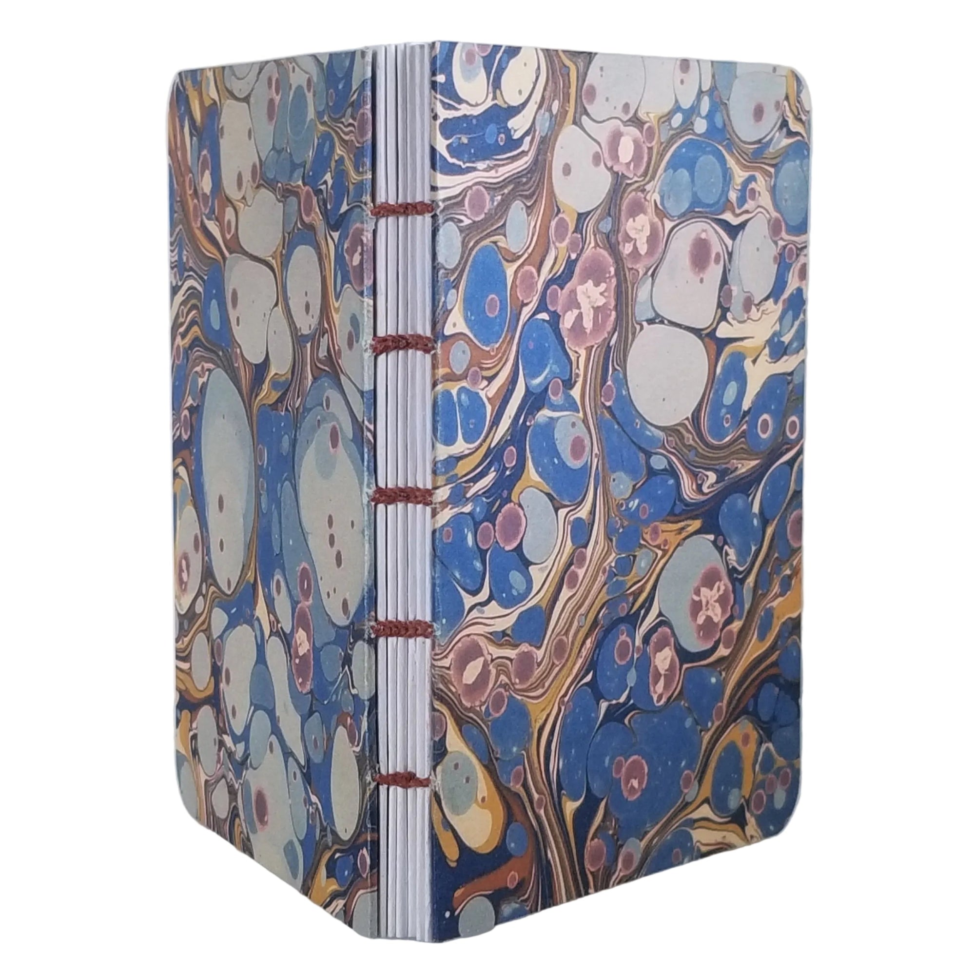handmade coptic-bound blank notebook with multicolor printed marbled covers in blues, greys, rust, and gold, bound with rust waxed linen thread, ~4x5.5" 96 pages, shown on a white background