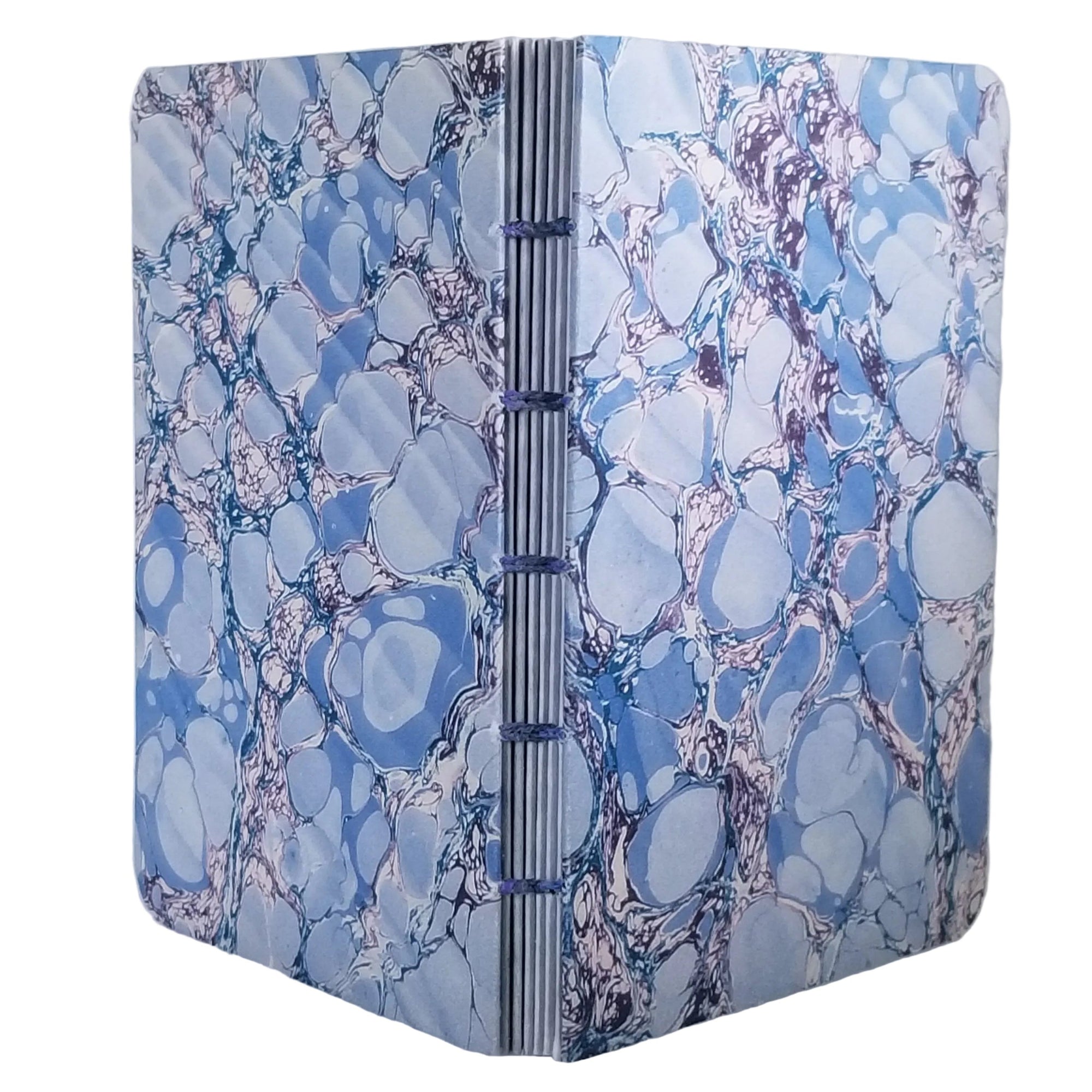 handmade coptic-bound blank notebook with multicolor printed marbled covers in blues with purple rivulets, bound with a purple waxed linen thread, ~4x5.5" 96 pages, shown on a white background