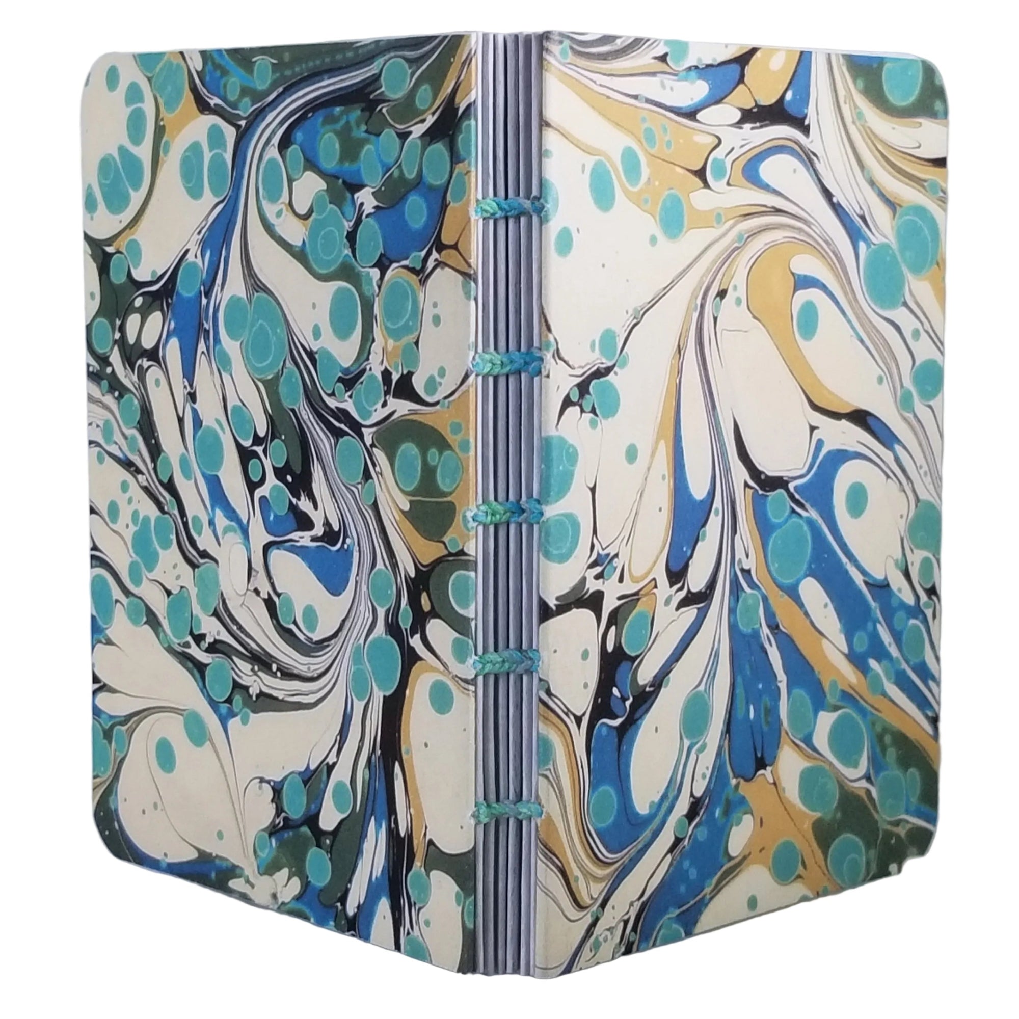 handmade small blank journal with predominantly cream and blue printed paper marbling pattern, exposed spine, and variegated thread in matching colors, ~4x5.5" 96 pages, shown on a white background