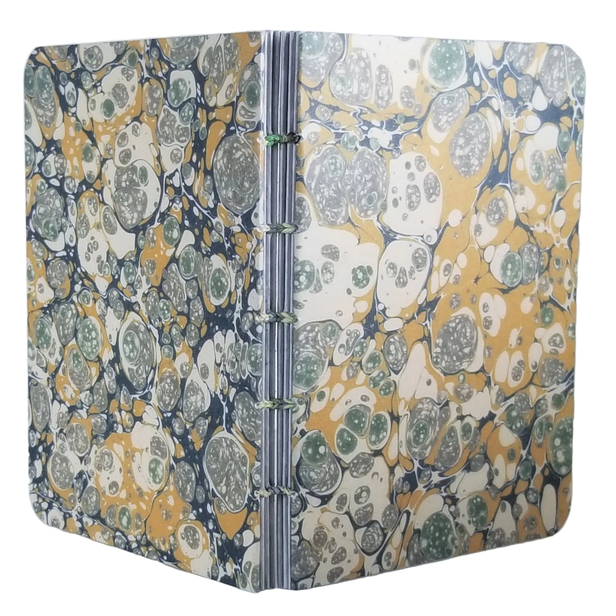 handmade small blank journal with predominantly gold and green printed paper marbling pattern, exposed spine, and variegated color matching thread, ~4x5.5" 96 pages, shown on a white background