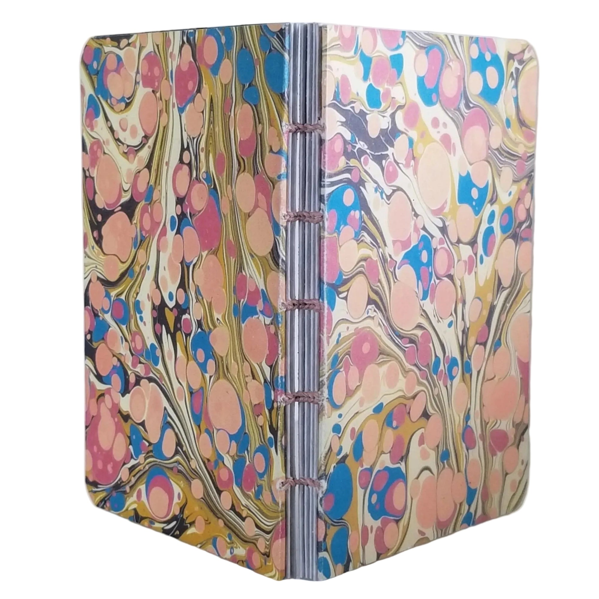 handmade small blank journal with cream, pink, and blue printed paper marbling pattern, exposed spine, and pale pink thread, ~4x5.5" 96 pages, shown on a white background