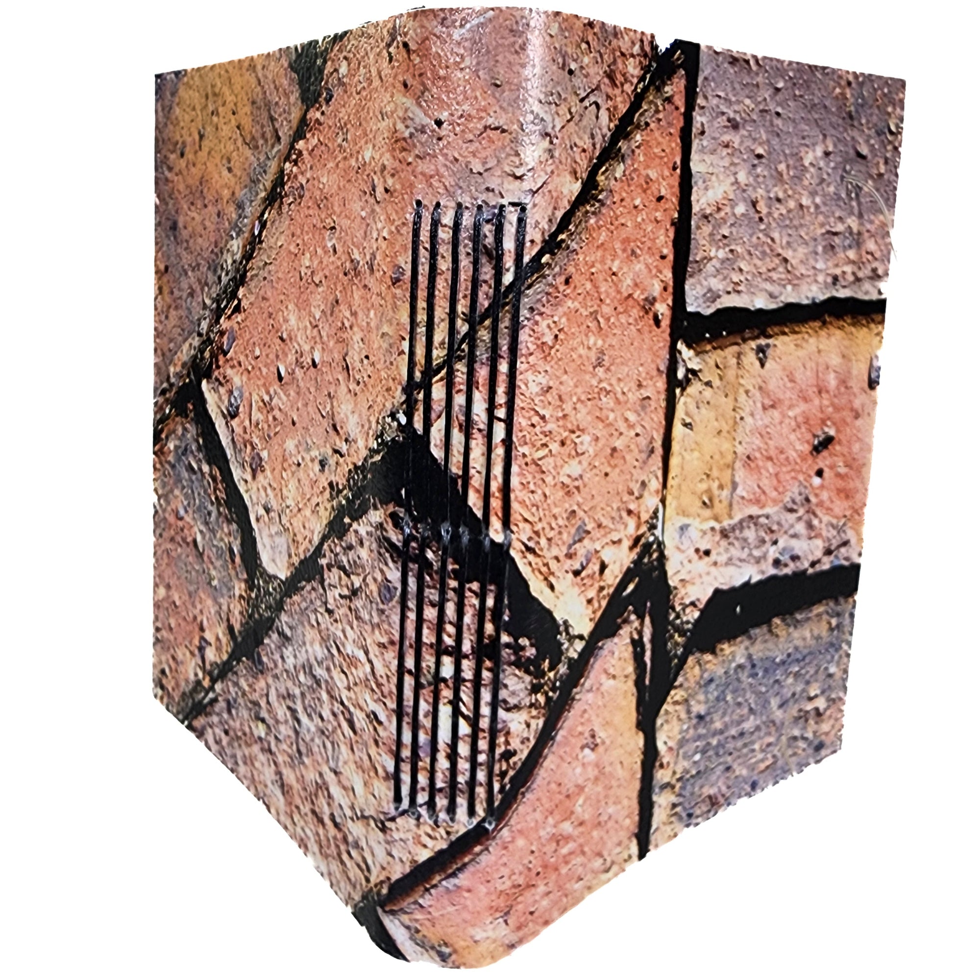 The cover photograph is a tight detail of an old brick sidewalk; longstitch-bound with black polyester thread; six signatures of white paper with elastic closure; ~4x5.5" 120 pages. 