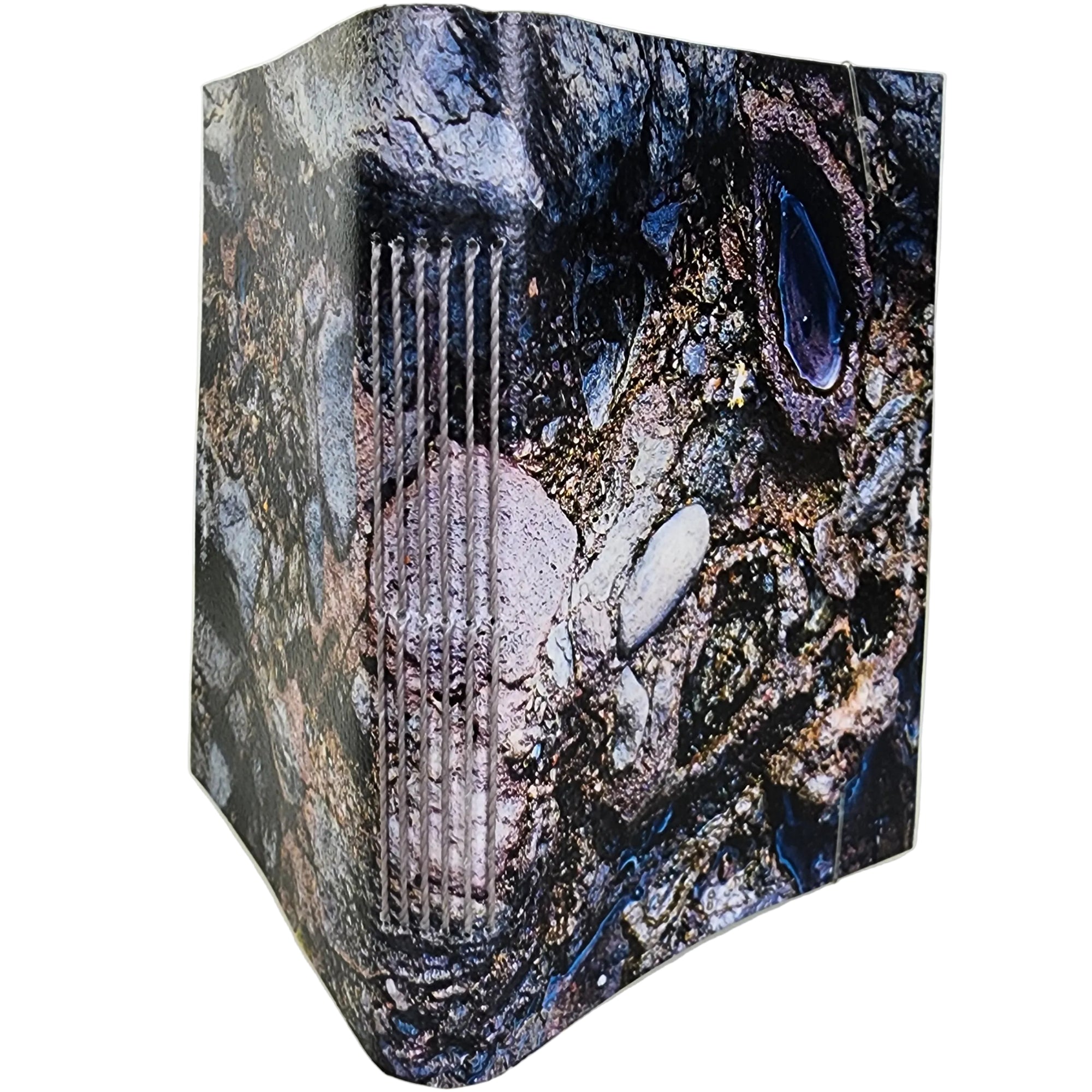 0367 photowrap journal, cover image of weather-worn stones, rocks, and pooling water; grey longstitch binding, coated cover, clear elastic closure