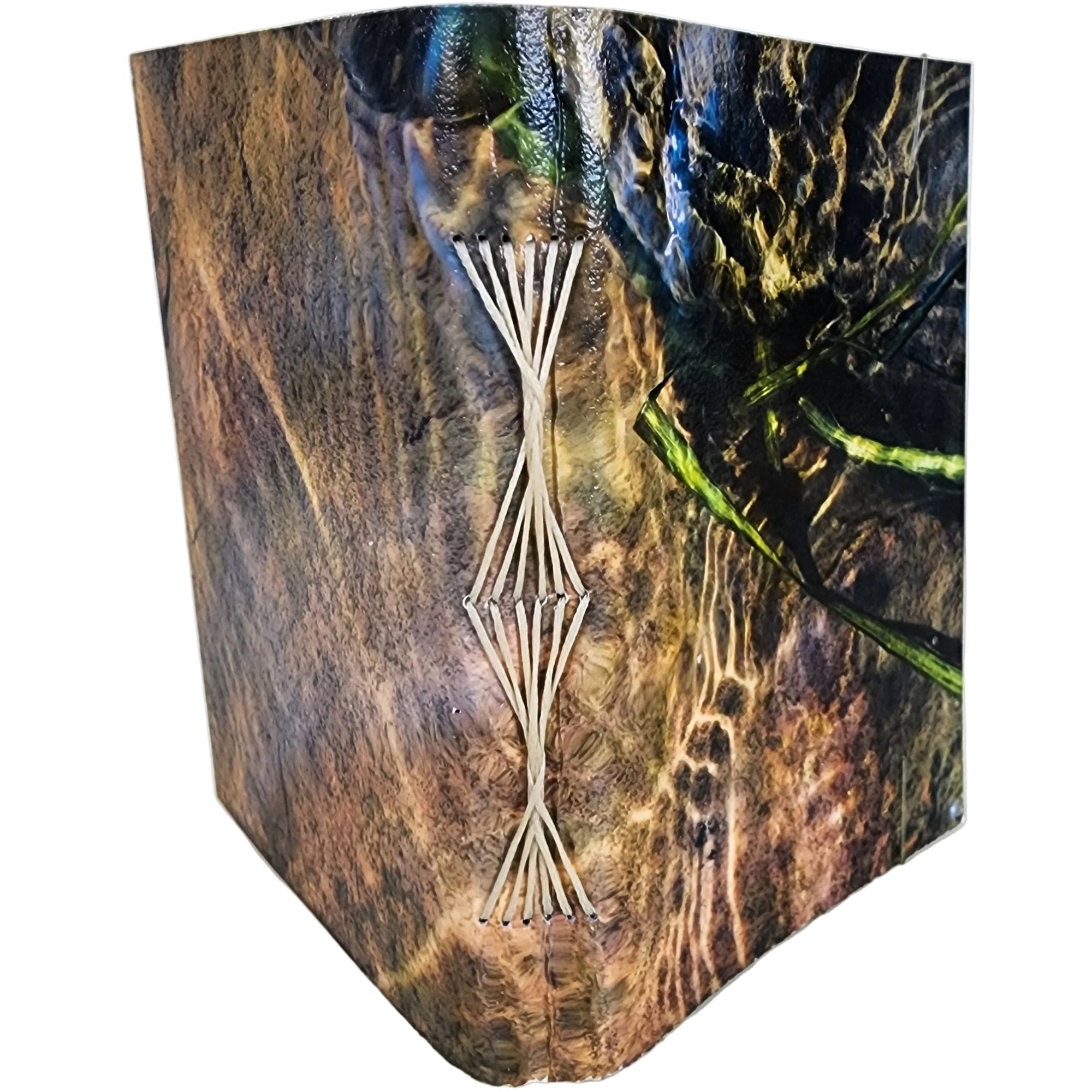 0564 photowrap journal, image of ripples over rocks, cream butterfly-longstitch binding, coated cover, clear elastic closure; price reduced